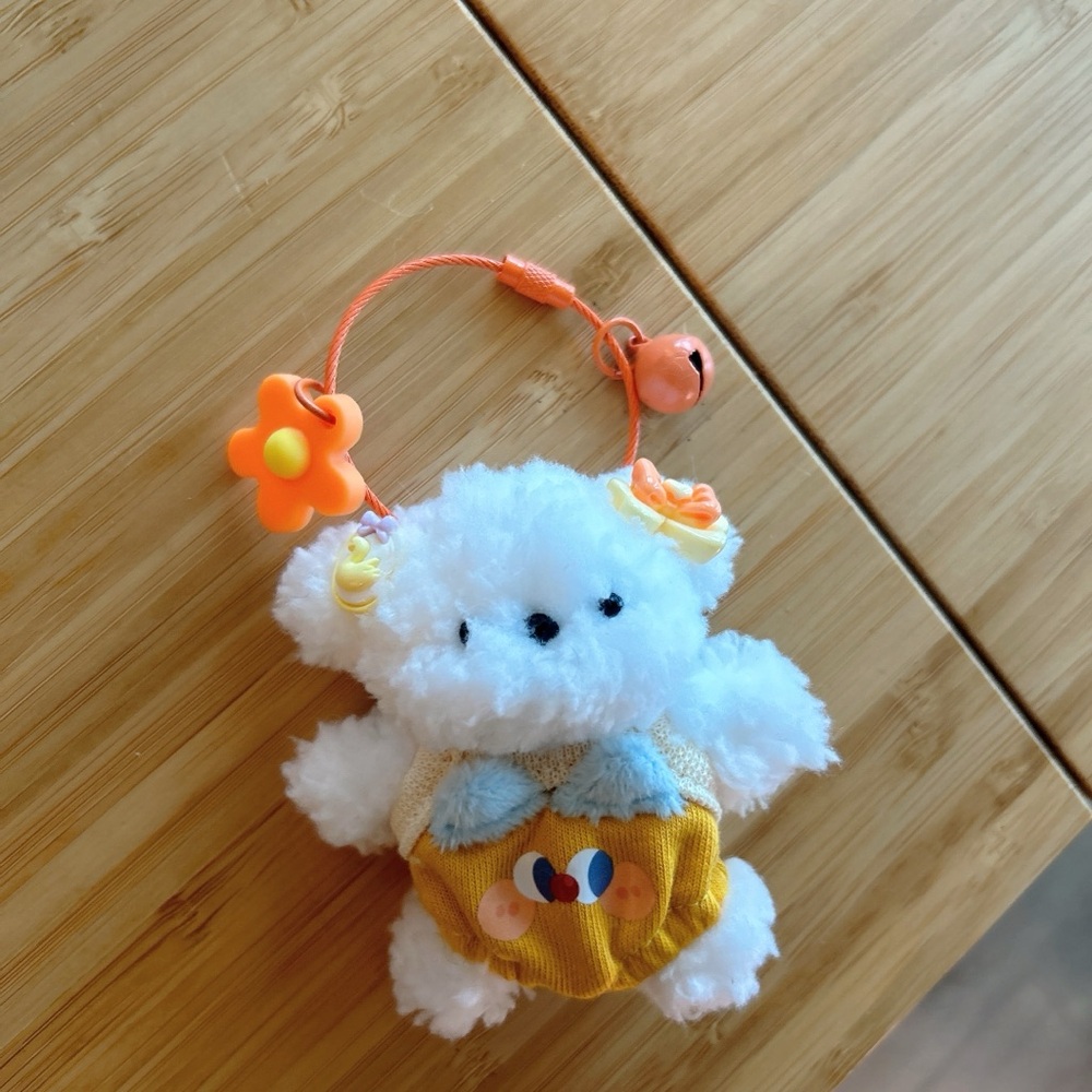 Fluffy White Plush Toy with Orange Accents